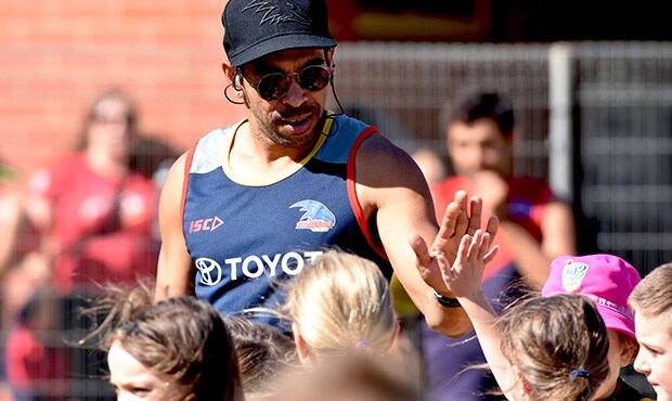 FFC1.jpg Eddie Betts congratulating a young goal kicker